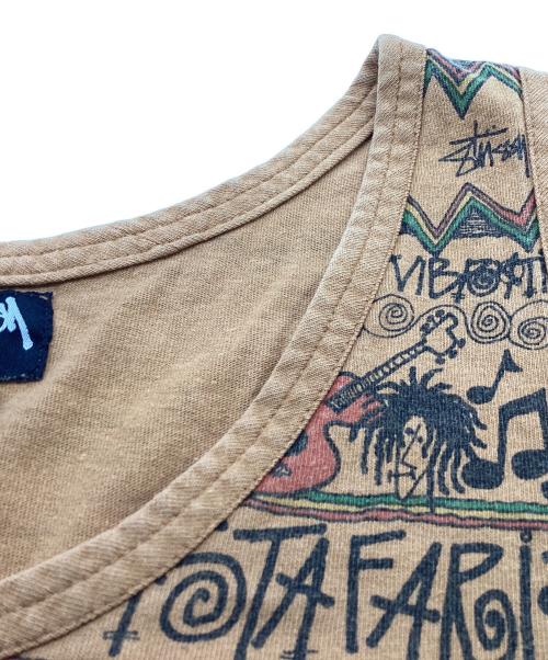 stussy（ステューシー）stussy (ステューシー) REGGAE TOMTOM 総柄タンクトップ / USA製 OLD ブラウン サイズ:Lの古着・服飾アイテム