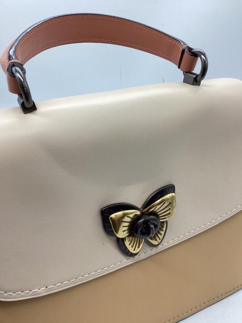 COACH（コーチ）COACH (コーチ) パーカー トップ ハンドル ウィズ バタフライ ターンロック　/　69605 ピンク×アイボリーの古着・服飾アイテム