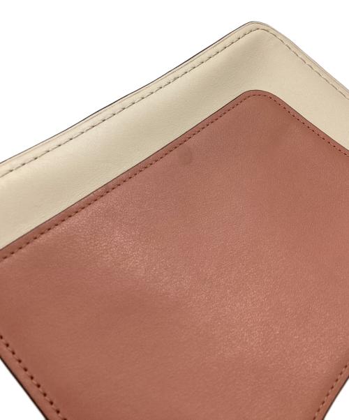 COACH（コーチ）COACH (コーチ) パーカー トップ ハンドル ウィズ バタフライ ターンロック　/　69605 ピンク×アイボリーの古着・服飾アイテム