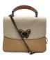 COACH（コーチ）の古着「パーカー トップ ハンドル ウィズ バタフライ ターンロック　/　69605」｜ピンク×アイボリー