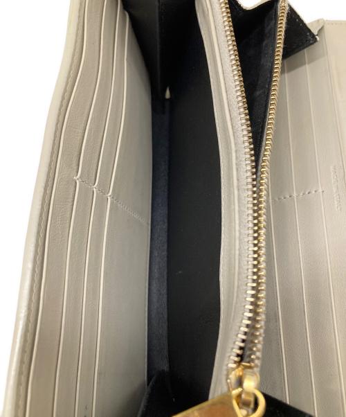 Yves Saint Laurent（イヴサンローラン）Yves Saint Laurent (イヴサンローラン) カサンドラYSLラージフラップウォレット アイボリーの古着・服飾アイテム