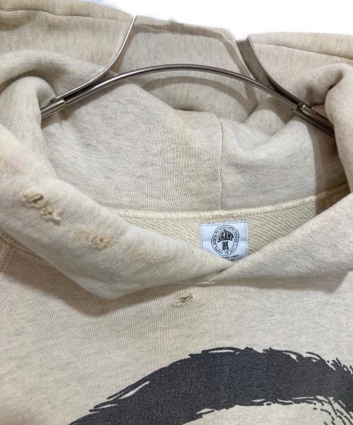 SAINT MICHAEL（セントマイケル）SAINT MICHAEL (セントマイケル) RAGLAN HOODIE eye　ラグランフーディーアイ　ダメージ加工　21SS　SM-S21-0000-036 アイボリー サイズ:Lの古着・服飾アイテム