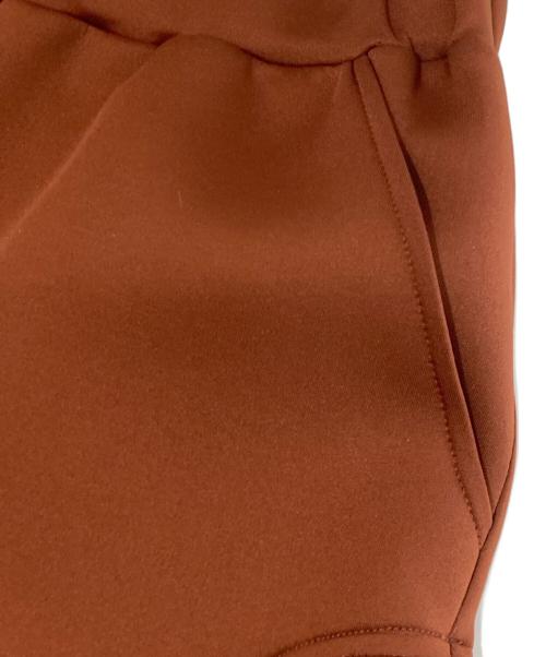 UN3D.（アンスリード）UN3D. (アンスリード) SLIDE CUT FLARE PT / スライドカットフレアパンツ　522340701501-01 オレンジ サイズ:36の古着・服飾アイテム