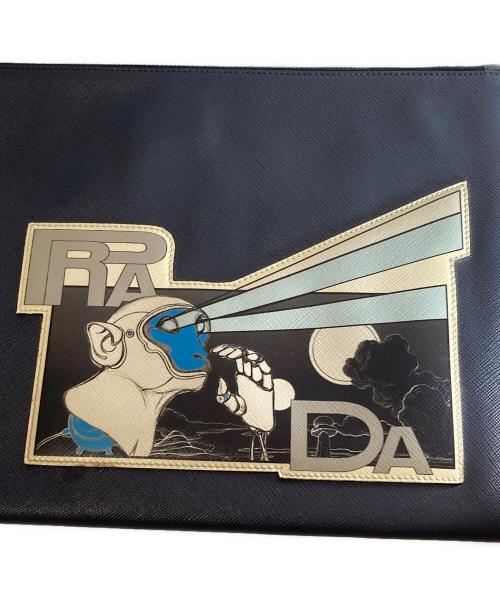PRADA（プラダ）PRADA (プラダ) MONKEY ROBOT CLUTCH モンキーロボットクラッチバッグ 三角プレート ネイビーの古着・服飾アイテム