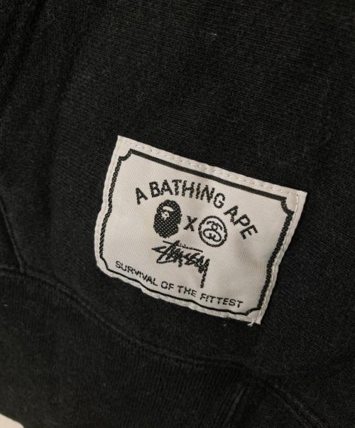 stussy（ステューシー）stussy (ステューシー) A BATHING APE (ア ベイシング エイプ) アームロゴプリント ジップアップ フーディ ブラック サイズ:Mの古着・服飾アイテム