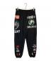 SAINT MICHAEL（セントマイケル）の古着「コラージュ グラフィック スウェットパンツ」｜ブラック