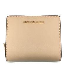 MICHAEL KORS（マイケル・コース）の古着「JET SET TRAVEL 2つ折り財布」｜ベージュ