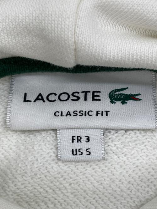 LACOSTE（ラコステ）LACOSTE (ラコステ) モノグラムレイヤードオーバルロゴスウェットフーディー ホワイト サイズ:3の古着・服飾アイテム