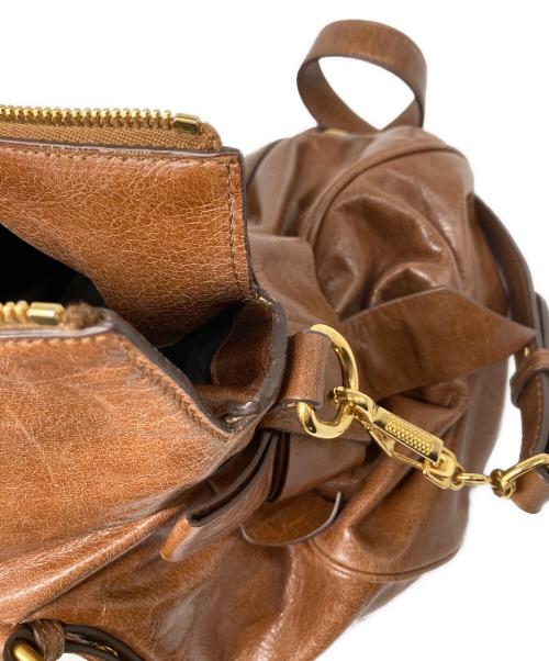 MIU MIU（ミュウミュウ）MIU MIU (ミュウミュウ) VITELLO LUX ヴィッテロリュクス サイドリボン 2WAYハンドバッグ ブラウンの古着・服飾アイテム