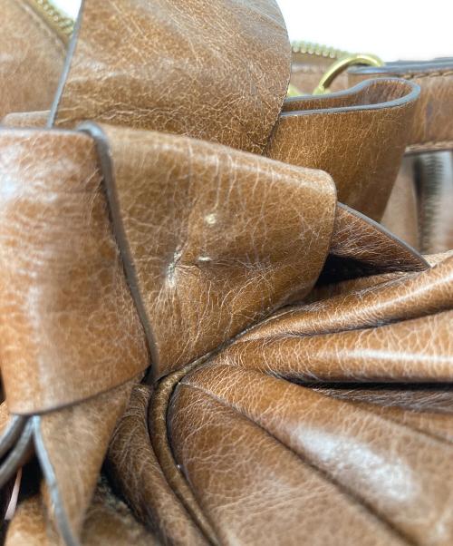 MIU MIU（ミュウミュウ）MIU MIU (ミュウミュウ) VITELLO LUX ヴィッテロリュクス サイドリボン 2WAYハンドバッグ ブラウンの古着・服飾アイテム