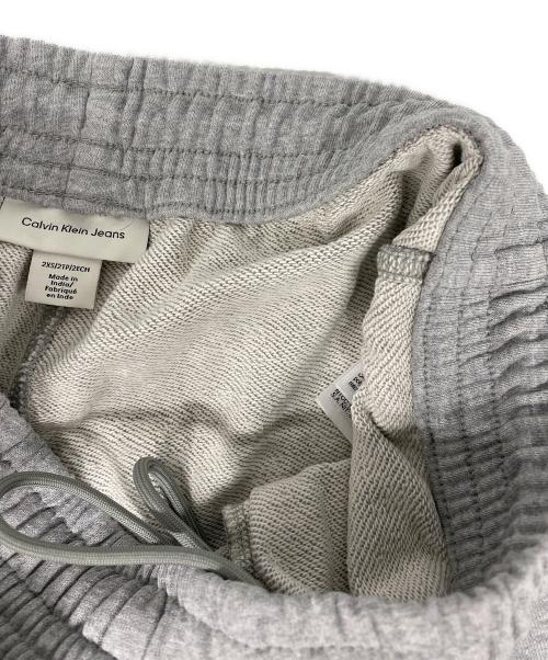 Calvin Klein Jeans（カルバンクラインジーンズ）Calvin Klein Jeans (カルバンクラインジーンズ) モノグラムロゴフレンチテリージョガーパンツ グレー サイズ:2ＸＳの古着・服飾アイテム