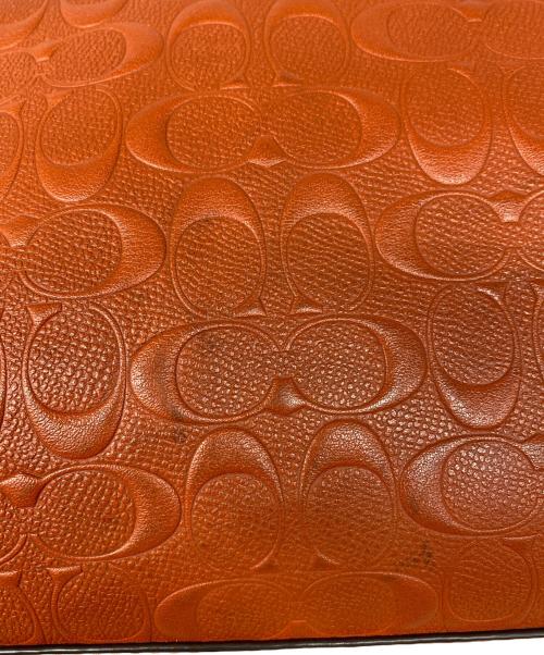COACH（コーチ）COACH (コーチ) Large Signature Embossed Leather Tote オレンジの古着・服飾アイテム