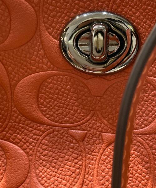 COACH（コーチ）COACH (コーチ) Large Signature Embossed Leather Tote オレンジの古着・服飾アイテム
