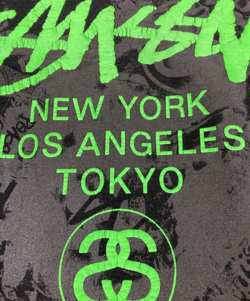 stussy（ステューシー）stussy (ステューシー) WORLD TOUR TEE グリーン×ブラック サイズ:Lの古着・服飾アイテム