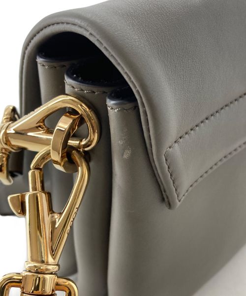 TOD'S（トッズ）TOD'S (トッズ) Tタイムレスレザーフラップバッグミニ ブラウンの古着・服飾アイテム