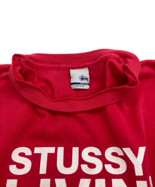 stussy（ステューシー）stussy (ステューシー) 銀タグ LIVIN' ロゴグラフィックプリントTシャツ レッド サイズ:MEDIUMの古着・服飾アイテム