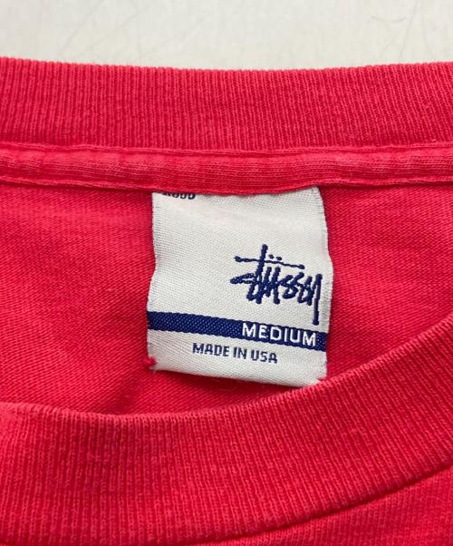 stussy（ステューシー）stussy (ステューシー) 銀タグ LIVIN' ロゴグラフィックプリントTシャツ レッド サイズ:MEDIUMの古着・服飾アイテム
