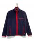 Patagonia（パタゴニア）の古着「SYNCHILLA CARDIGAN」｜ネイビー×レッド