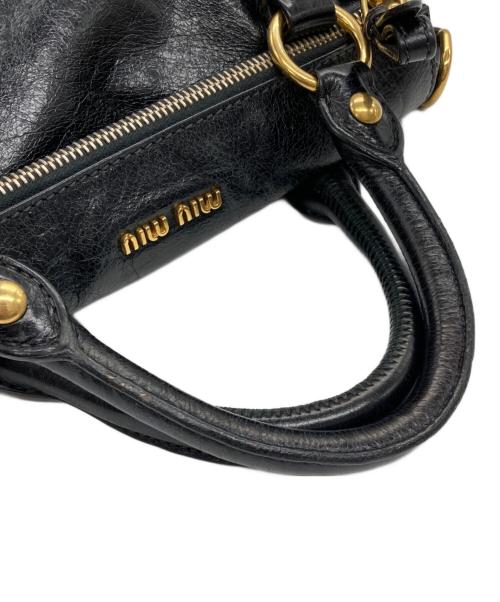 MIU MIU（ミュウミュウ）MIU MIU (ミュウミュウ) VITELLO LUX サイドリボン 2WAYバッグ ブラック×ゴールドの古着・服飾アイテム