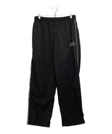 The Ennoy Professional（ザ エンノイ プロフェッショナル）の古着「PIPING NYLON TRACK PANT」｜ブラック