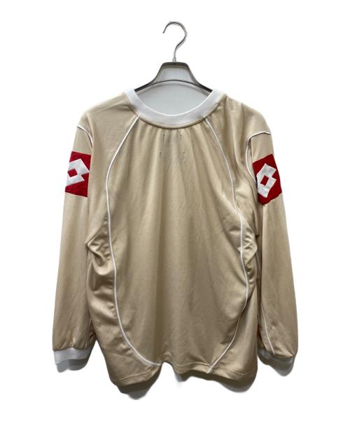 LOTTO（ロット）LOTTO (ロット) Diaspora skateboards (ディアスポラスケートボードズ) Scudetto Shirt ベージュ サイズ:Ｍの古着・服飾アイテム