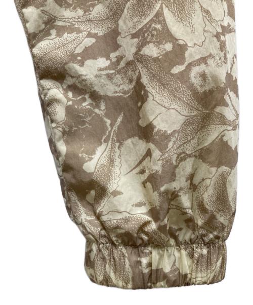 NIKE（ナイキ）NIKE (ナイキ) ウーブン フルジップ プリント ジャケット ベージュ サイズ:Sの古着・服飾アイテム