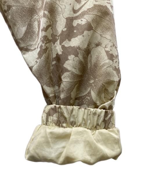 NIKE（ナイキ）NIKE (ナイキ) ウーブン フルジップ プリント ジャケット ベージュ サイズ:Sの古着・服飾アイテム