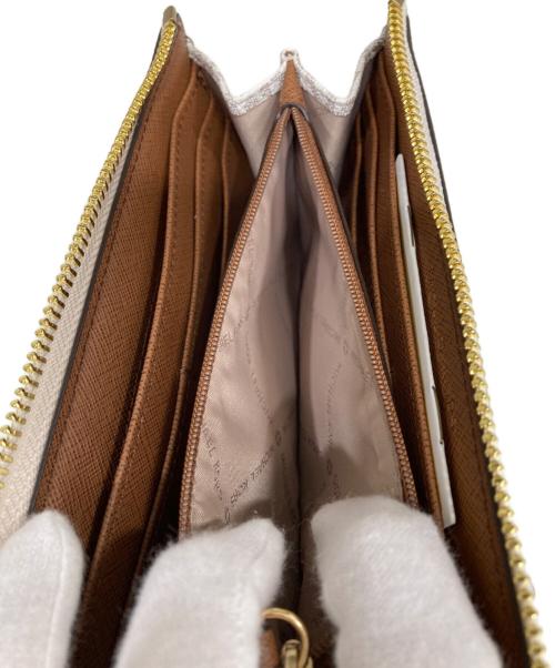 MICHAEL KORS（マイケル・コース）MICHAEL KORS (マイケル・コース) ジェットセット トラベル シグネチャー ラージ スリー クォーター Lジップウォレット ホワイト サイズ:OneSizeの古着・服飾アイテム