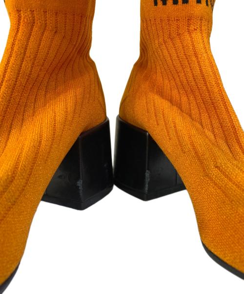 MM6 Maison Margiela（エムエムシックスメゾンマルジェラ）MM6 Maison Margiela (エムエムシックスメゾンマルジェラ) フレアソックスブーツ オレンジ サイズ:36の古着・服飾アイテム