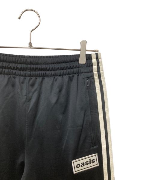 adidas（アディダス）adidas (アディダス) oasis (オアシス) ツアー ファイヤーバード トラックパンツ ブラック サイズ:Mの古着・服飾アイテム