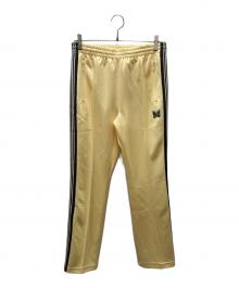 Needles（ニードルズ）の古着「トラックパンツ」｜イエロー