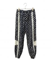LOUIS VUITTON（ルイ ヴィトン）の古着「24AW モノグラムプリントテクニカルトラックロングパンツ トラックパンツ」｜ダークネイビー×ホワイト