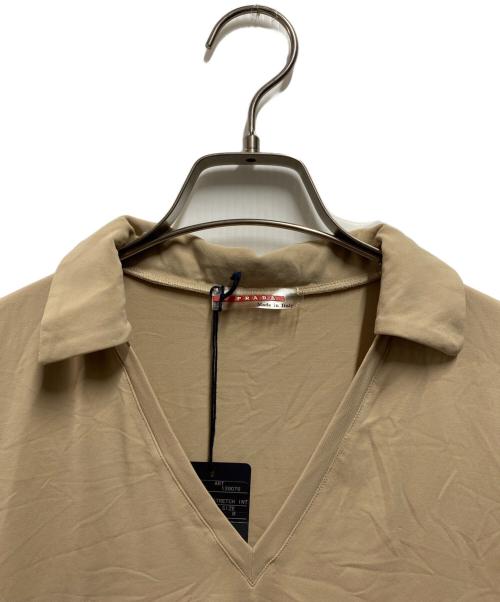 PRADA SPORTS（プラダスポーツ）PRADA SPORTS (プラダスポーツ) バッグポケットポロシャツ ベージュ サイズ:Ｍ 未使用品の古着・服飾アイテム