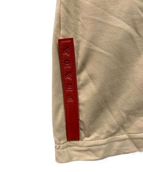 PRADA SPORTS（プラダスポーツ）PRADA SPORTS (プラダスポーツ) バッグポケットポロシャツ ベージュ サイズ:Ｍ 未使用品の古着・服飾アイテム