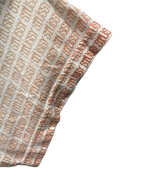 stussy（ステューシー）stussy (ステューシー) ロゴ総柄プリントＴシャツ ホワイト サイズ:Lの古着・服飾アイテム