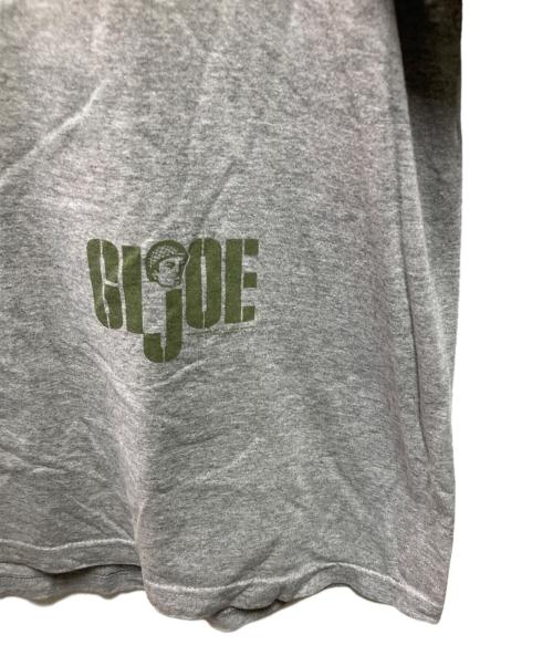 STANLEY DESANTIS（スタンリーデサンティス）STANLEY DESANTIS (スタンリーデサンティス) GI JOE Tシャツ グレー サイズ:Ｌの古着・服飾アイテム