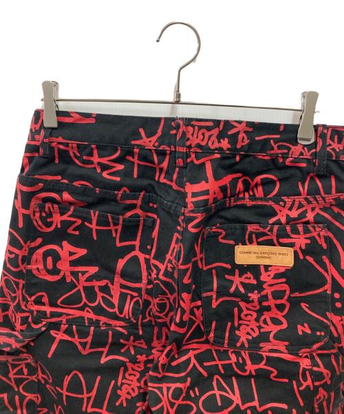 SUPREME（シュプリーム）SUPREME (シュプリーム) COMME des GARCONS SHIRT (コムデギャルソンシャツ) CANVAS PAINTER PANTS ブラック×レッド サイズ:30の古着・服飾アイテム