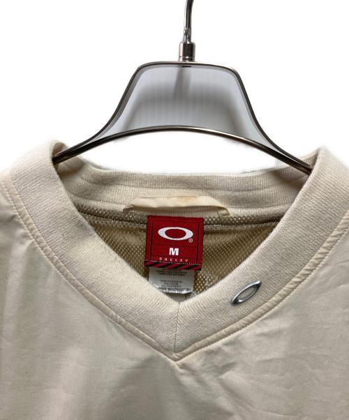 OAKLEY（オークリー）OAKLEY (オークリー) 90-00's S/S メタルロゴシャツ ベージュ サイズ:Mの古着・服飾アイテム