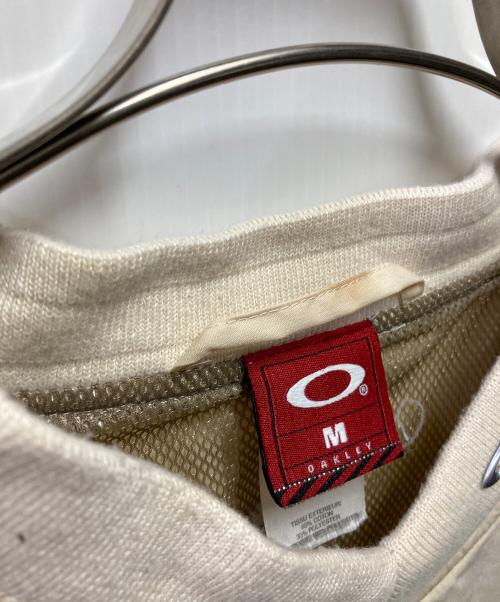 OAKLEY（オークリー）OAKLEY (オークリー) 90-00's S/S メタルロゴシャツ ベージュ サイズ:Mの古着・服飾アイテム