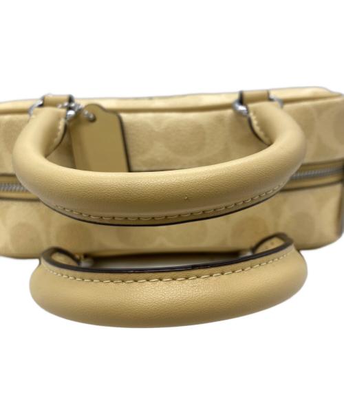 COACH（コーチ）COACH (コーチ) PEANUTS (ピーナッツ) サッチェル クロスボディ バッグ イエローの古着・服飾アイテム