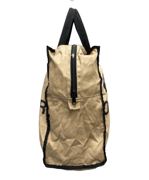 COMME des GARCONS（コムデギャルソン）COMME des GARCONS (コムデギャルソン) ロゴプリントホリデーシーズンメッセージバッグ ベージュの古着・服飾アイテム