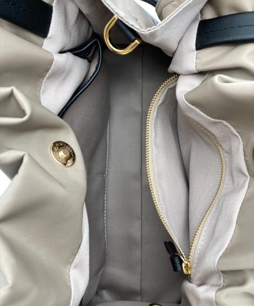 VIOLAd'ORO（ヴィオラドーロ）VIOLAd'ORO (ヴィオラドーロ) BIANCA ナイロンドロストトートバッグ ベージュ×ブラックの古着・服飾アイテム