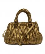 MIU MIUミュウミュウ）の古着「マテラッセ 2WAYバッグ London 2012 Special Edition 15/18」｜ゴールド