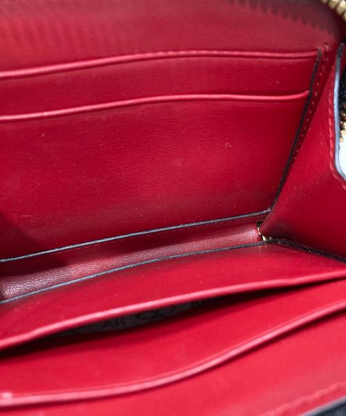 ANYA HINDMARCH（アニヤ・ハインドマーチ）ANYA HINDMARCH (アニヤハインドマーチ) ツイストリボンデザイン二つ折り財布 ブラックの古着・服飾アイテム