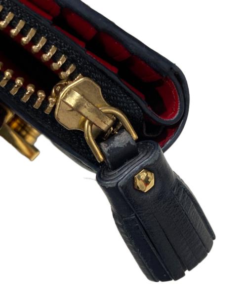 ANYA HINDMARCH（アニヤ・ハインドマーチ）ANYA HINDMARCH (アニヤハインドマーチ) ツイストリボンデザイン二つ折り財布 ブラックの古着・服飾アイテム