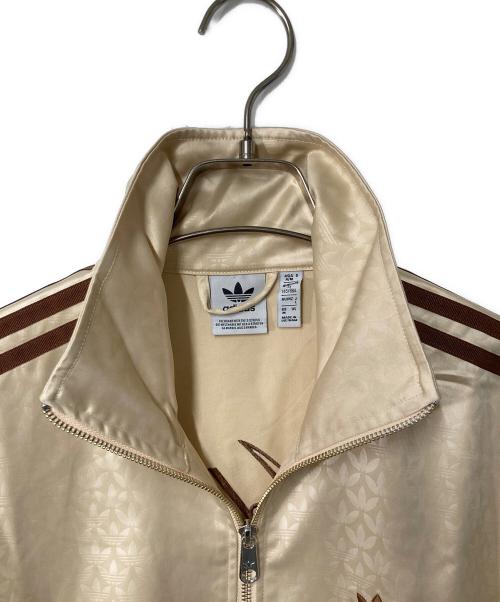 adidas（アディダス）adidas (アディダス) モノグラム サテン ファイヤーバード トラックジャケット ベージュ×ブラウン サイズ:Ｍの古着・服飾アイテム