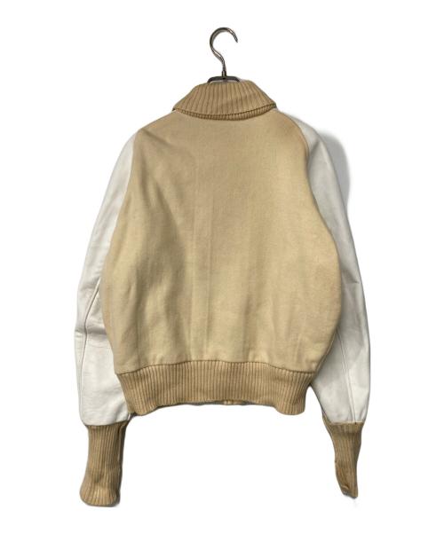 skookum（スクーカム）skookum (スクーカム) レザースリーブスタジャン USA製 ベージュ×ホワイト サイズ:38の古着・服飾アイテム