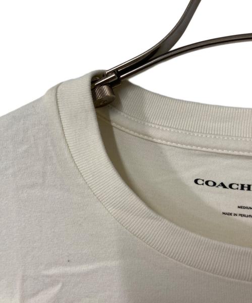 COACH（コーチ）COACH (コーチ) SNOOPY (スヌーピー) スヌーピー シグネチャー スクエア Tシャツ アイボリー サイズ:Mの古着・服飾アイテム