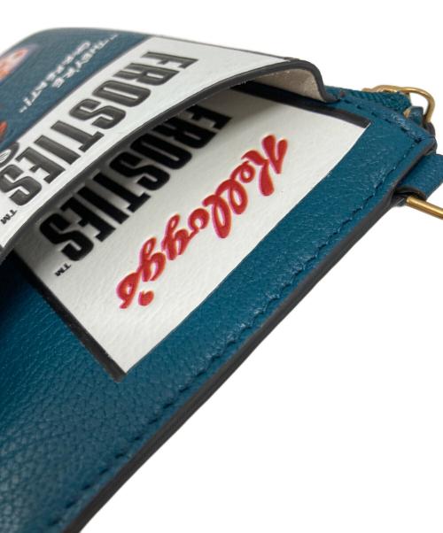 ANYA HINDMARCH（アニヤ・ハインドマーチ）ANYA HINDMARCH (アニヤ・ハインドマーチ) KELLOGGS (ケロッグ) KELLOGGS トニーザタイガー ジップフォンポーチ ターコイズの古着・服飾アイテム