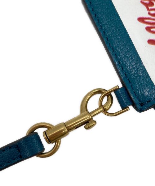 ANYA HINDMARCH（アニヤ・ハインドマーチ）ANYA HINDMARCH (アニヤ・ハインドマーチ) KELLOGGS (ケロッグ) KELLOGGS トニーザタイガー ジップフォンポーチ ターコイズの古着・服飾アイテム